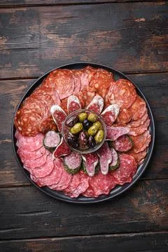 Antipasto platter cold meat with chorizo, fuet,salami, salchichon and longani Stock Photos