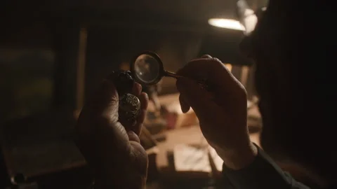 An antiquarian checking an old item 스톡 동영상 258293565