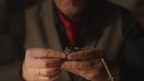 Antiquarian checking a skull item 스톡 동영상 258298389