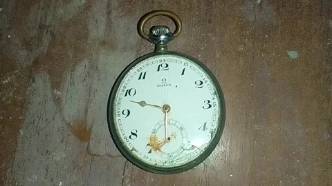 Antique 1912 Swiss Omega Pocket Watch Silver broken at a dirty table