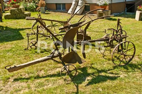 Antique agriculture machine plough Stock Photos