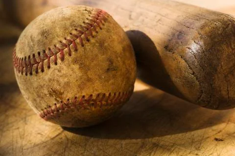 Antique baseball with baseball bat Stock Photos