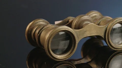 Antique binoculars on dark reflective background Stock Footage 71632730