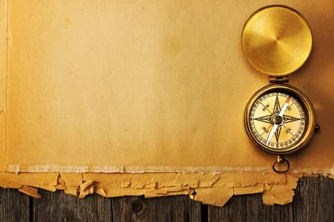 Antique brass compass over old background Antique brass compass over old p... 스톡 사진