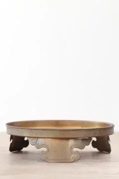 Antique brass on wooden table Stock Photos