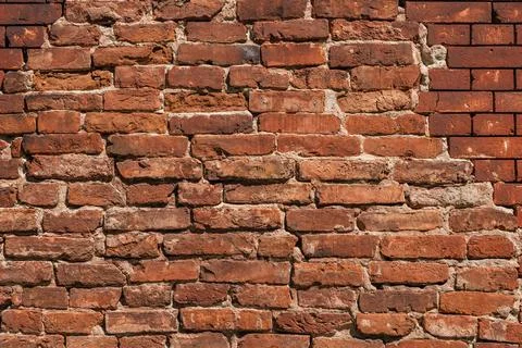 Antique brick wall background, ancient red brick masonry surface. Textured ba Stock Photos