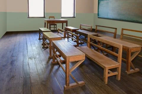 Antique classroom in school with Rows of empty wooden desks Stock Photos