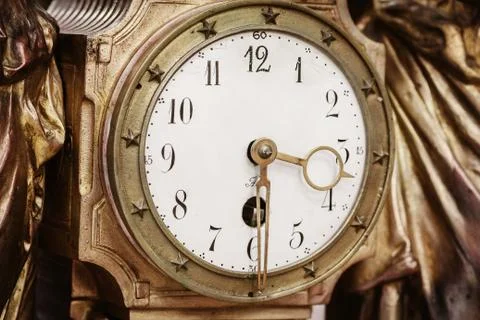 Antique clock with arabian numerals in the classical style Stock Photos