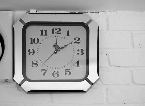 ANTIQUE CLOCK MOUNTED ON WALL Stock Photos