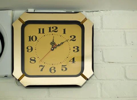 ANTIQUE CLOCK MOUNTED ON WALL Stock Photos