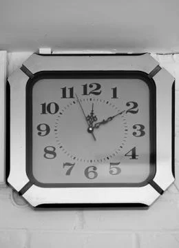 ANTIQUE CLOCK MOUNTED ON WALL Stock Photos