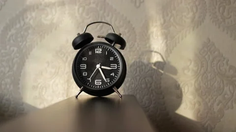 An antique clock stands in the bedroom by the bed Stock Footage 232492998