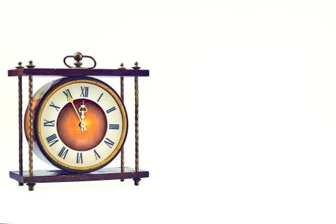 Antique clock on a white background. Five to twelve. Stock Photos