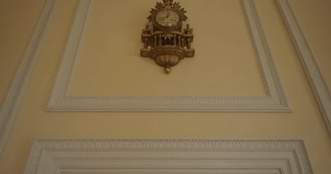 Antique Clock On The Yellow Wall In An Ancient Mansion Stock Footage 107557218