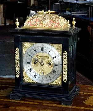 Antique Clockwork Clock In Auction Room Stock Photos