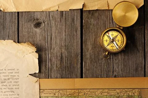 Antique compass over old map Antique brass compass over old map Copyright:... Stock Photos