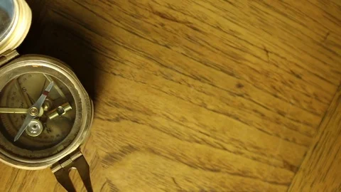 Antique Compass on Wood Table Stock Footage 80773263