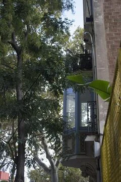 Antique corner balcony with openwork patterns and beautiful plaster Stock Photos