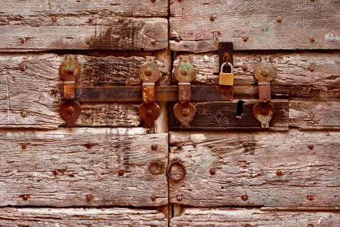 Antique detail door with rusty latch Фото