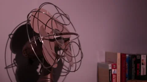 Antique fan being turned on and then off Stock Footage