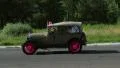 Antique Ford Model T Phaeton with Canadian flag, pink wheels HD Footage