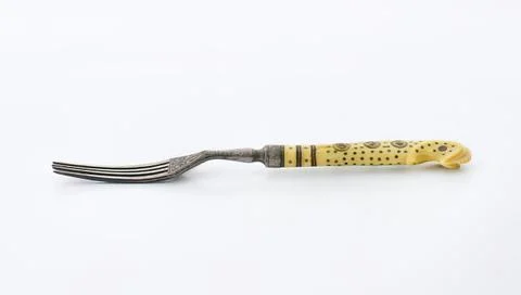 Antique fork with yellow bone handle Stock-Fotos