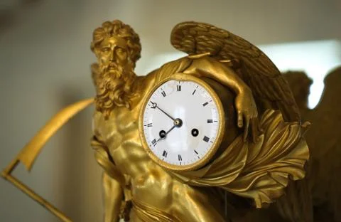 Antique gilded clock Stock Photos