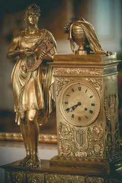 Antique gilded clock Stock Photos