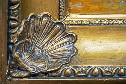 Antique gilded frame with a decorative frame Stock Photos