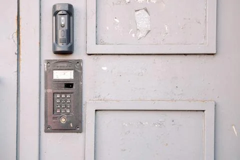 Antique gray door with intercom Stock Photos