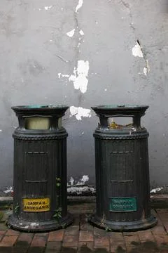 Antique green trash can, Garbage bins on the sidewalks of city streets in kota Stock Photos
