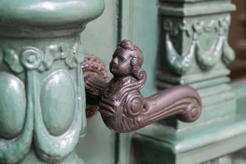 Antique Handle in the form of a human head or angel. Concept aged apartment h Photos