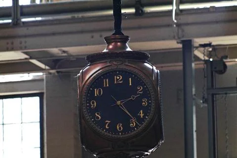 An antique hanging clock Photos