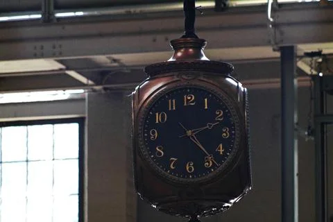 An antique hanging clock Photos