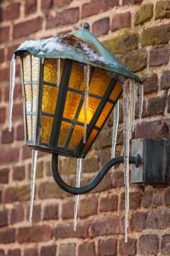 Antique lantern covered with icicles Foto stock