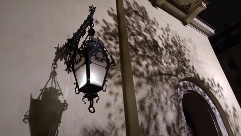 Antique lantern illuminates the picture. Gothic. Lutheran Church. Stock Footage 70231513