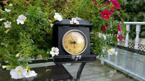 Antique leather clock box. Dolly shot showing yellow dial plate with clock Stock Footage 113272833
