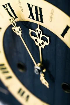 Antique looking clock dial showing time about twelve Stock Photos