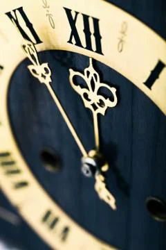 Antique looking clock dial showing time about twelve Stock Photos