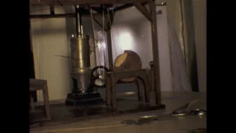 Antique machine pressing half a melon in workshop Stock Footage 291543416
