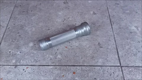 Antique Metal Flashlight Body Without Cap on Textured Stone Background Stock Footage 331914269