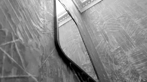 An antique mirror on the wall. Reflection in the mirror. Metal mirror. Stock Footage 303409760