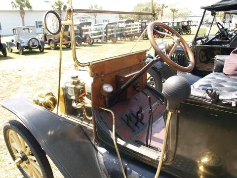 Antique Model T interior compartment with Steering Wheel and Hand Brake Stock Photos