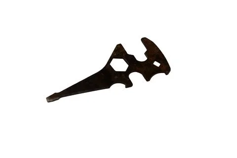 Antique multi-tool with intricate cutouts and a rustic, weathered appearance Stock Photos
