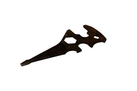 Antique multi-tool with intricate cutouts and a rustic, weathered appearance Stock Photos