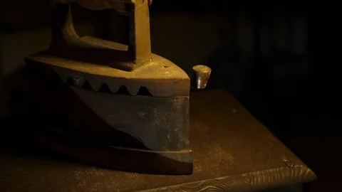 Antique old Iron in the attic - camera moving close on dolly 스톡 동영상 112720227