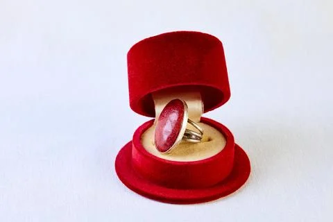 Antique open ring box in the shape of a man's hat. Made of red velvet Stock Photos