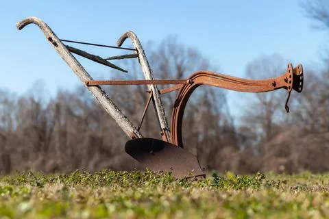 Antique plow in the Grass Stock Photos