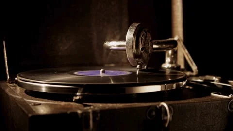 An antique record player spins a black vinyl disc Stock Footage 329559989