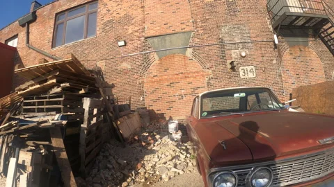 Antique Run-Down abandoned Car parked in Industrial Area - New York City Stock Footage 156560468